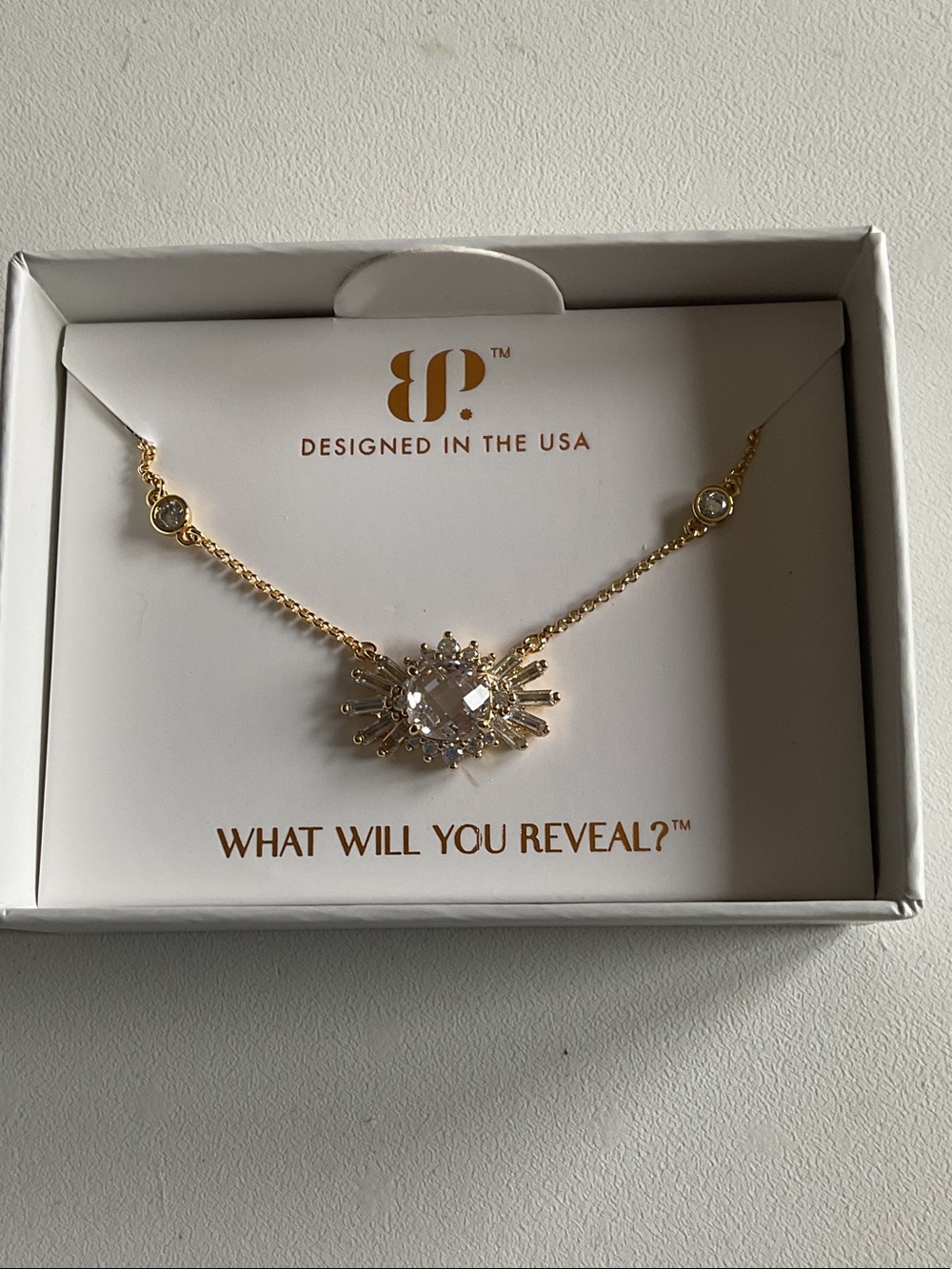 bp Gold Burst Pendant Necklace with White Crystal Center